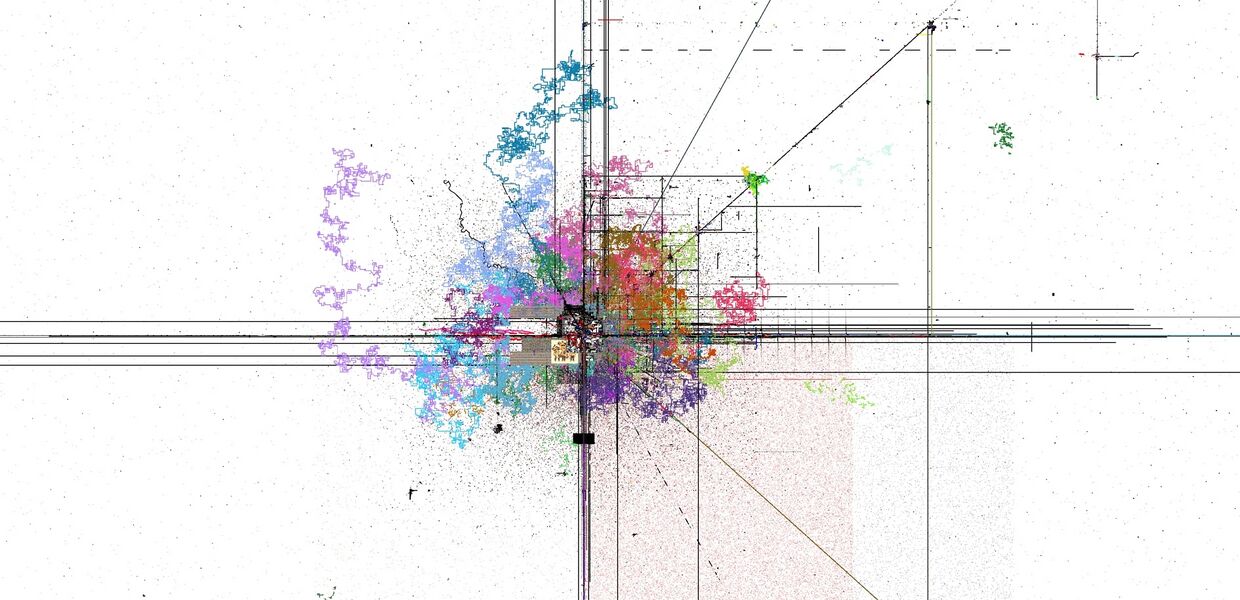 With color. The colorful scribbles were a script that would generate winding roads on the Mainpage. These roads have long since been deleted.