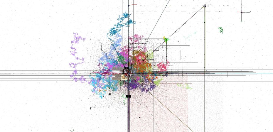 With color. The colorful scribbles were a script that would generate winding roads on the Mainpage. These roads have long since been deleted.